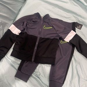 Black and grey track suit